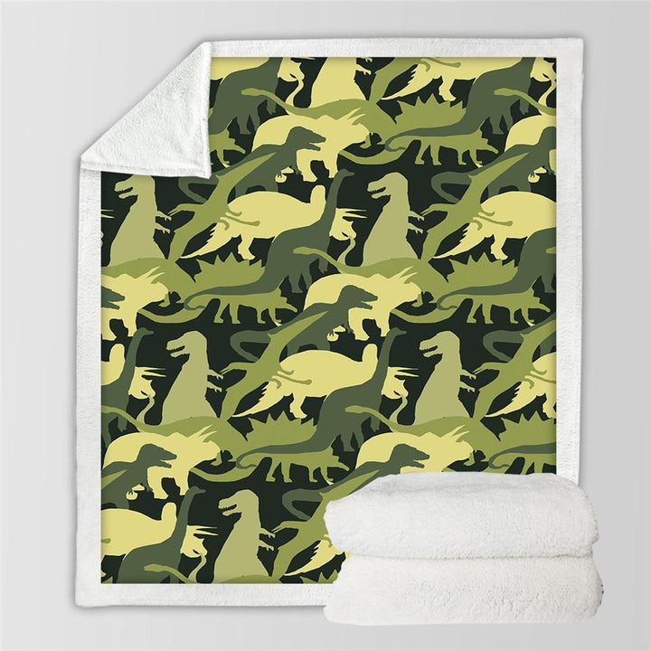 Kocyk z dinozaurami na łóżku dziecka